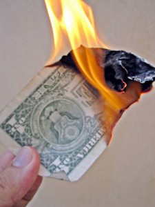 This is what happens when you overspend with your credit card. Put out the fire! Burning Money